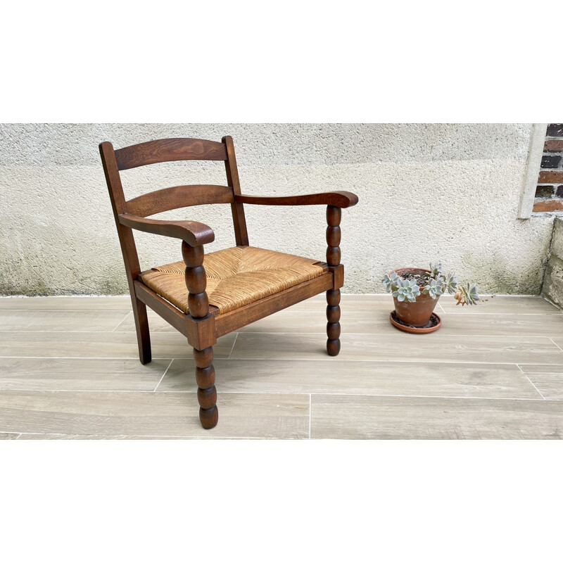 Vintage turned wood armchair with straw seat