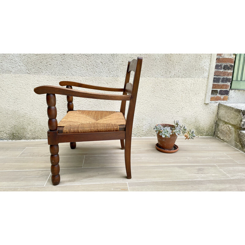 Vintage turned wood armchair with straw seat