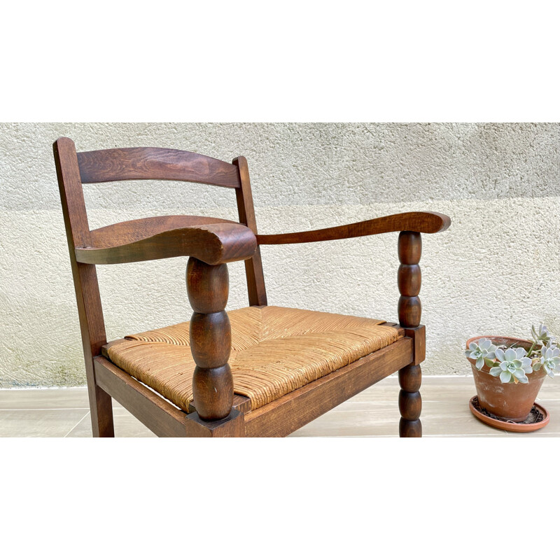 Vintage turned wood armchair with straw seat