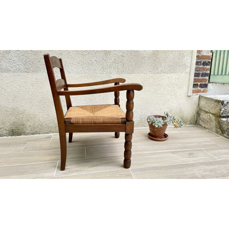 Vintage turned wood armchair with straw seat
