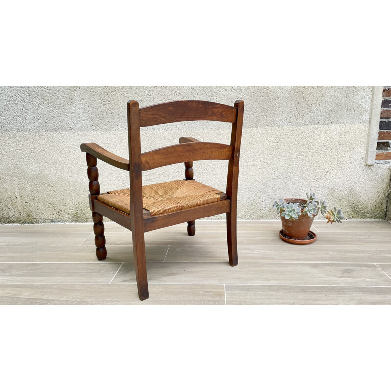 Vintage turned wood armchair with straw seat