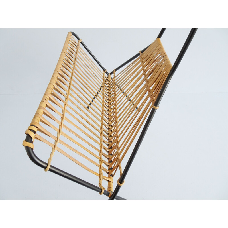 Vintage metal and rattan magazine rack in the shape of a rope