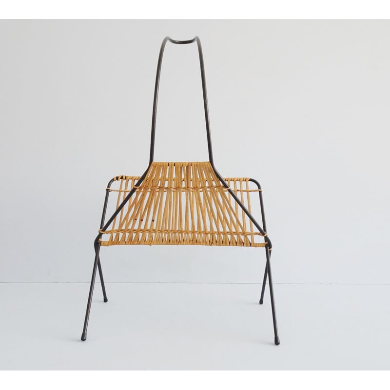 Vintage metal and rattan magazine rack in the shape of a rope