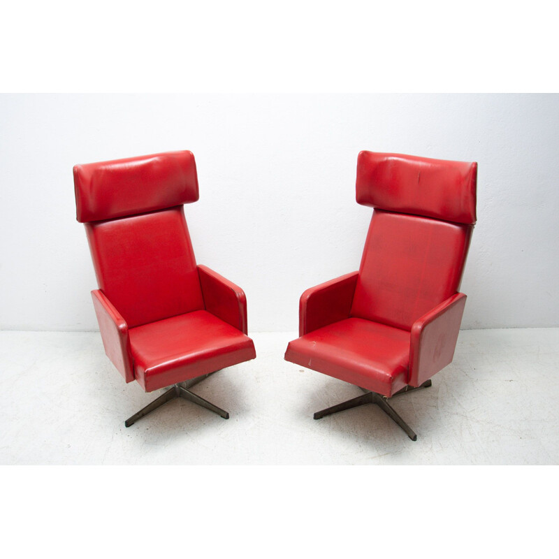 Pair of mid century Czechoslovak red swivel armchairs, 1970s