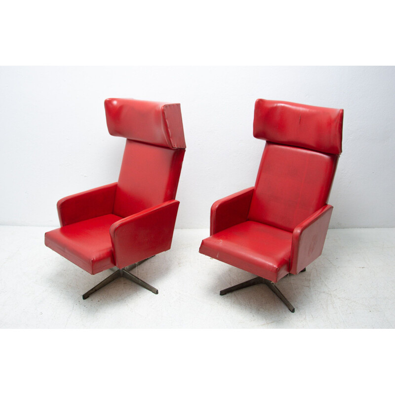 Pair of mid century Czechoslovak red swivel armchairs, 1970s