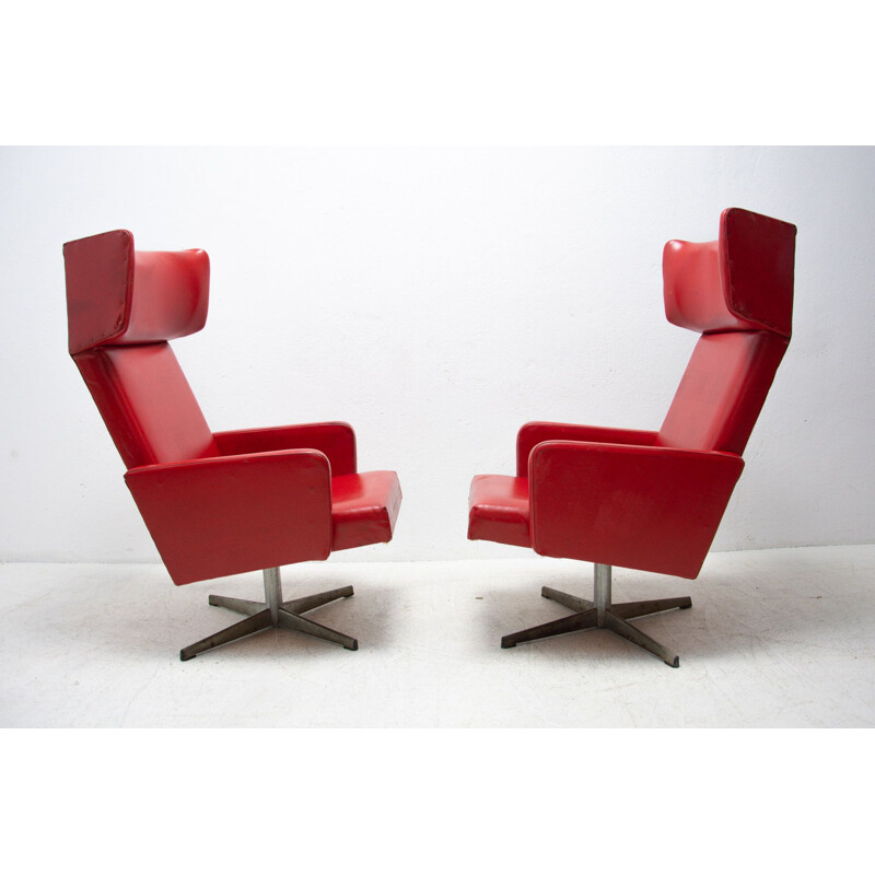 Pair of mid century Czechoslovak red swivel armchairs, 1970s