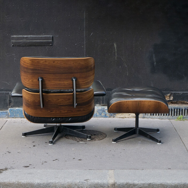 Black vintage armchair and ottoman by Charles & Ray Eames for Vitra, 1980
