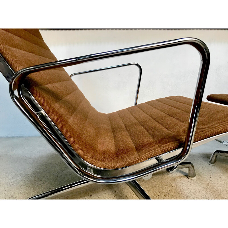 Vintage chromed aluminium armchair & ottoman by Charles & Ray Eames for Vitra, 1970s