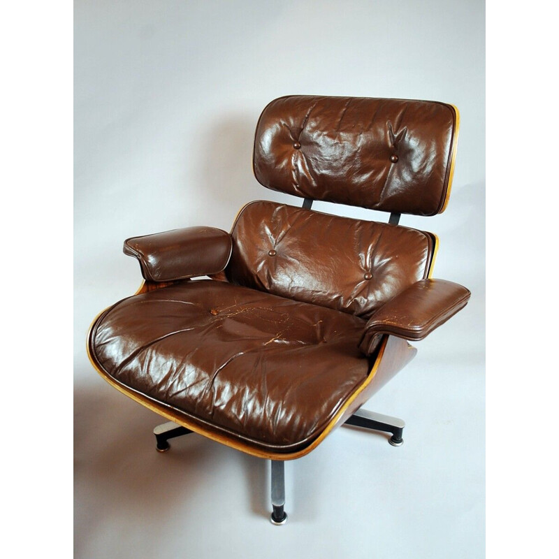 Vintage Eames armchair and ottoman by Herman Miller, 1950s