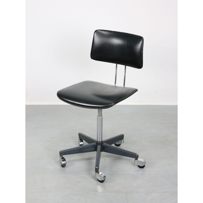 Mid-century black office swivel armchair by Stol Kamnik