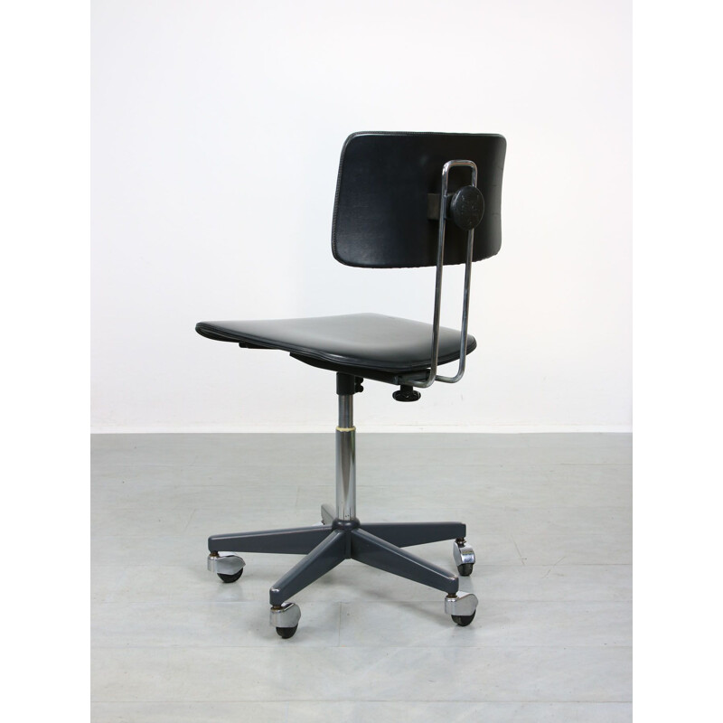 Mid-century black office swivel armchair by Stol Kamnik