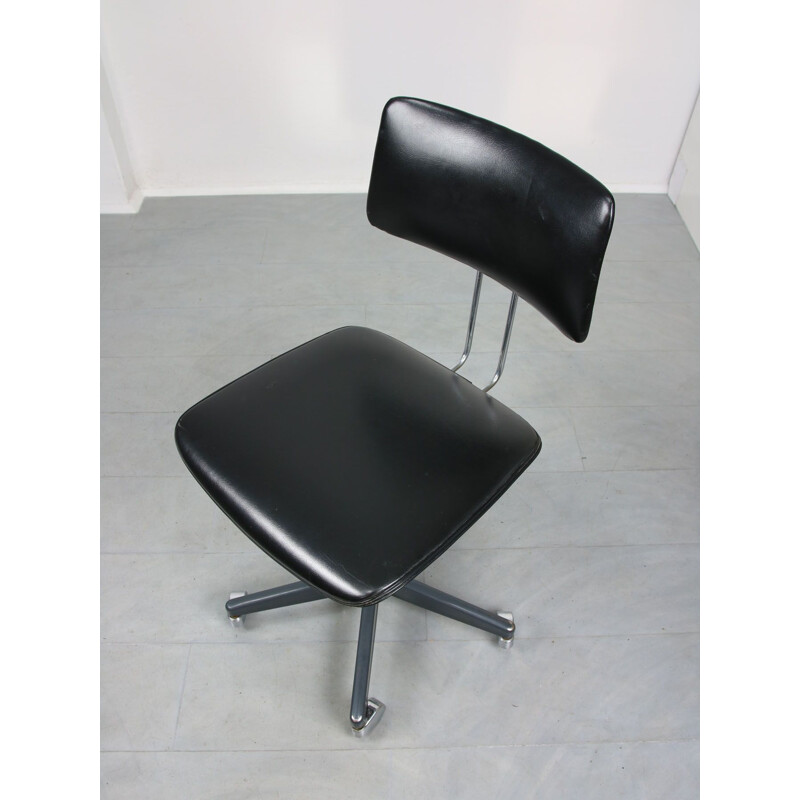 Mid-century black office swivel armchair by Stol Kamnik