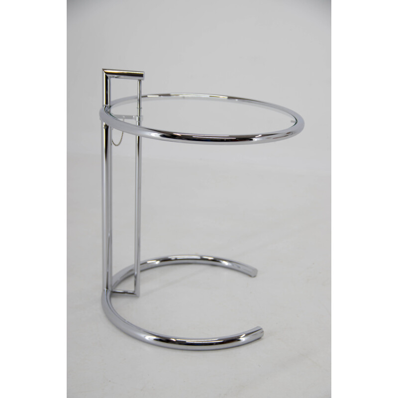 Vintage adjustable side table in chrome and crystal by Eileen Gray