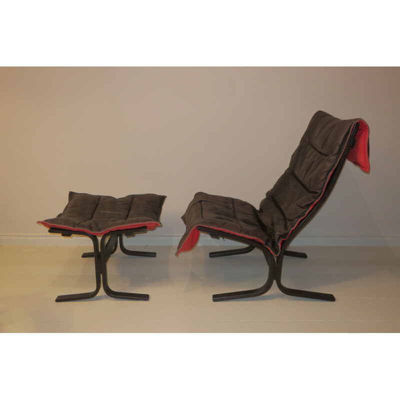 Vintage Siesta armchair and ottoman in black leather with red backing by Ingmar Relling