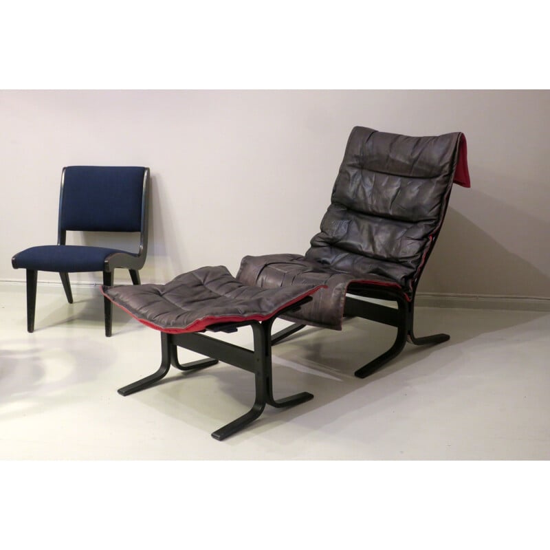 Vintage Siesta armchair and ottoman in black leather with red backing by Ingmar Relling