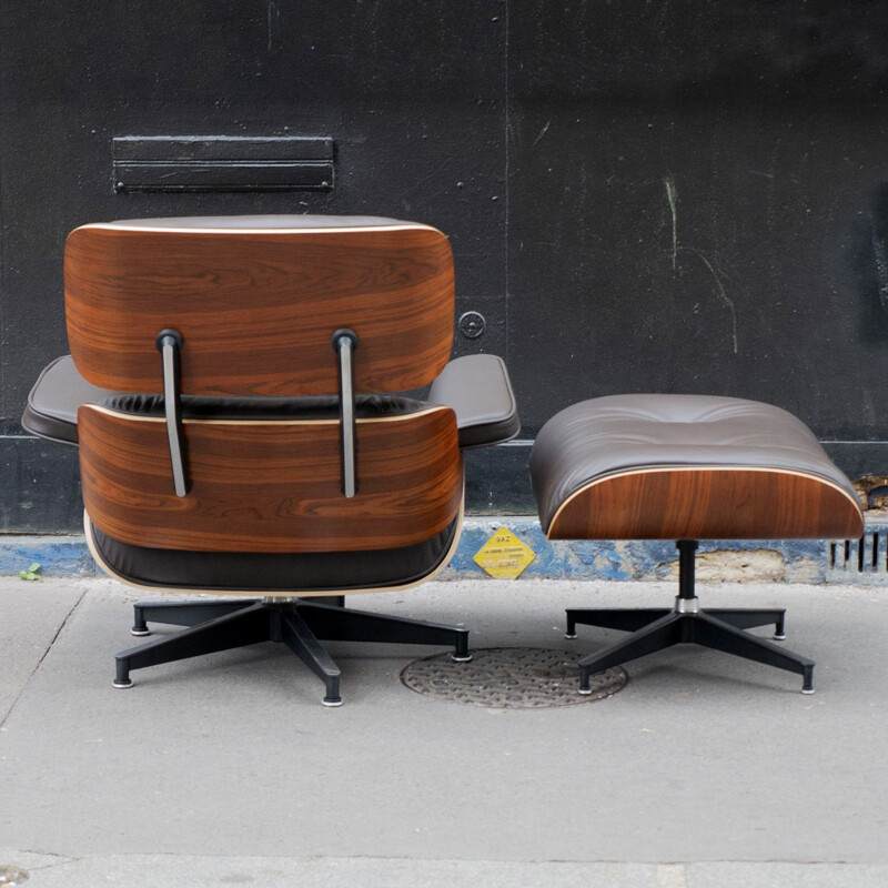 Vintage lounge chair and ottoman in rosewood by Charles and Ray Eames for Herman Miller