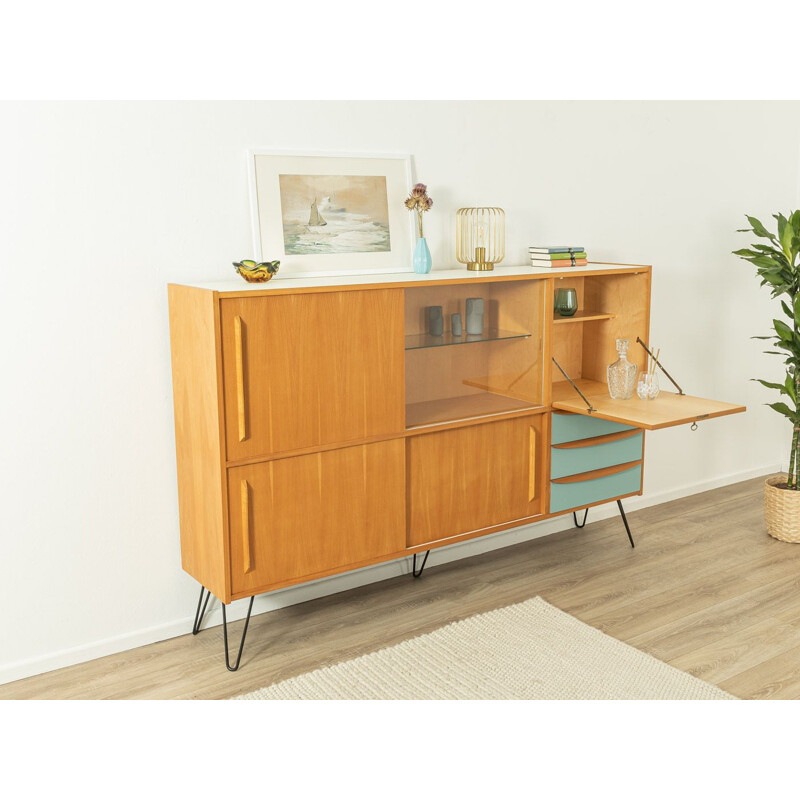 Vintage ashwood highboard with three sliding doors and blue drawers, Germany 1960s