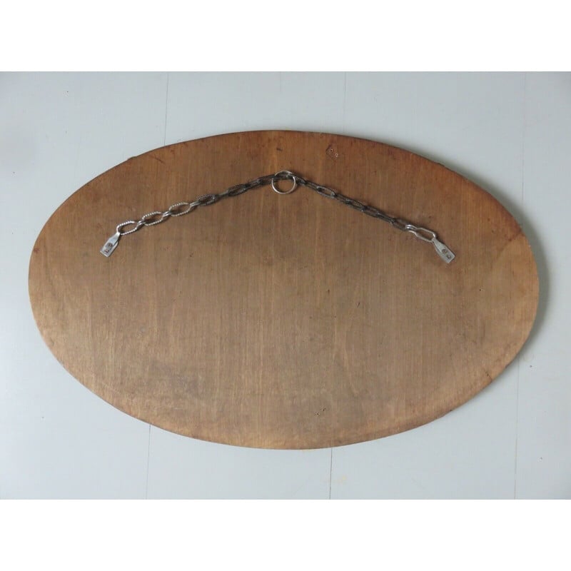Vintage oval wall mirror with chain on wood, 1930