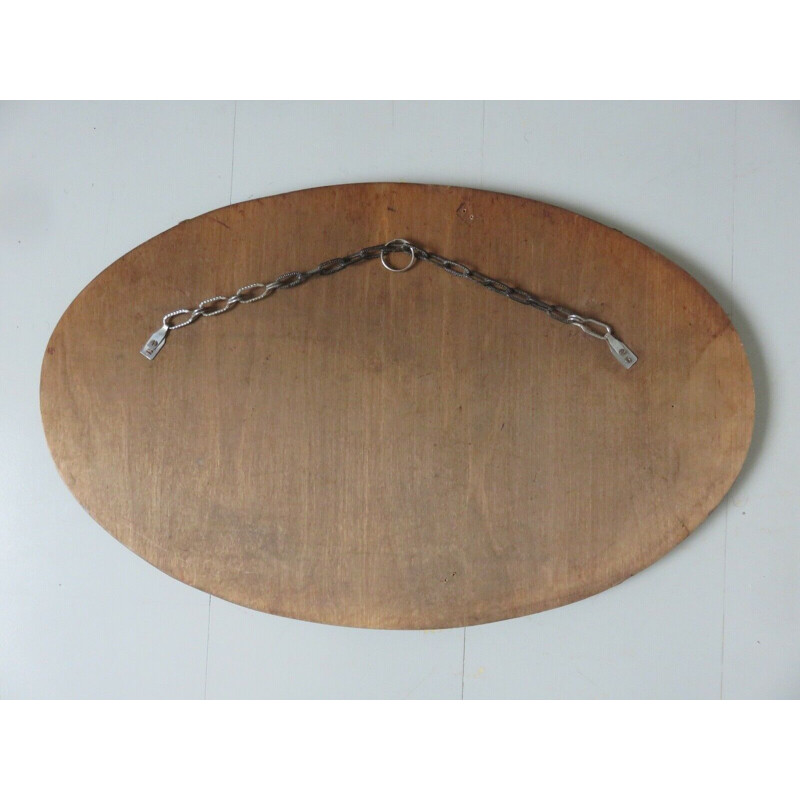 Vintage oval wall mirror with chain on wood, 1930