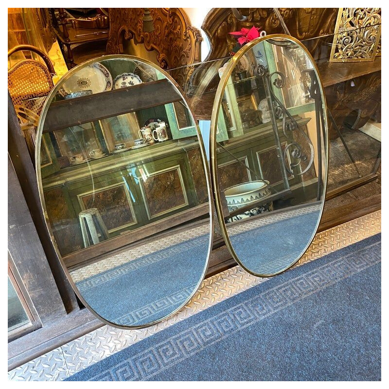Pair of Giò mid-century brass Italian oval wall mirrors, 1960s
