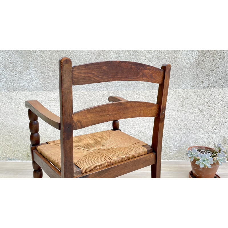 Fauteuil vintage en bois tourné et paille