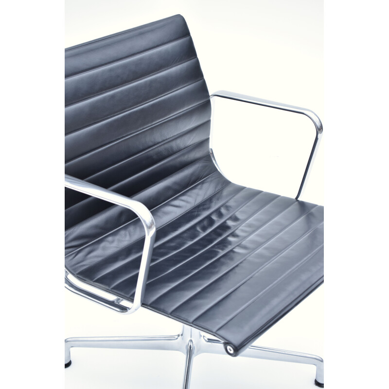 Vintage aluminium and leather armchair by Eames for Vitra