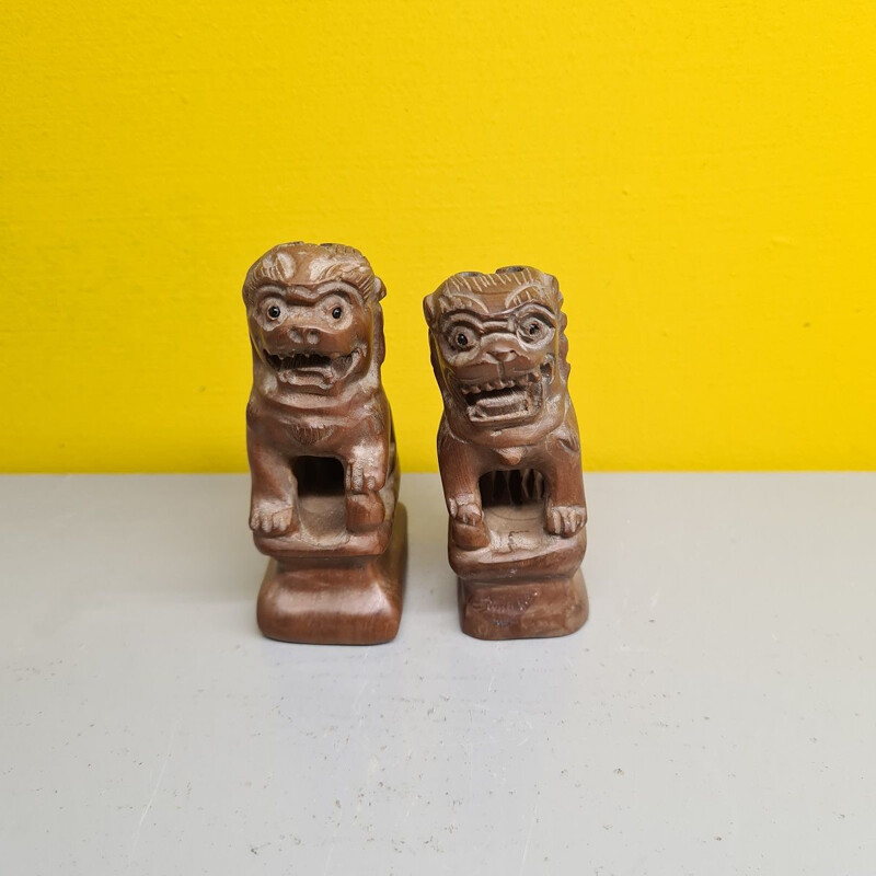Pair of vintage carved wood lions from an Asian temple
