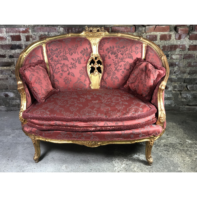 Carved and upholstered gilded wood vintage sofa