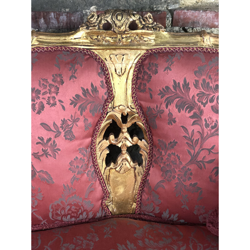 Carved and upholstered gilded wood vintage sofa