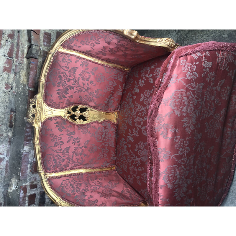 Carved and upholstered gilded wood vintage sofa