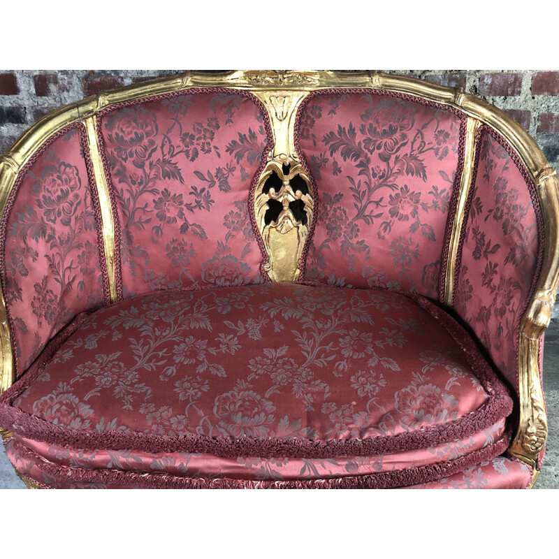 Carved and upholstered gilded wood vintage sofa