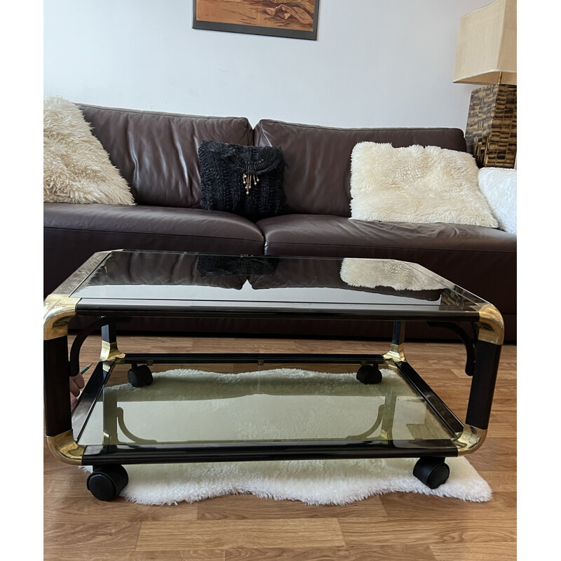 Vintage black and gold coffee table on casters, 1980