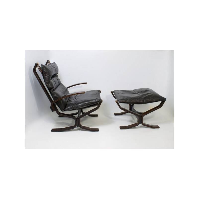 Vintage leather armchair with ottoman by Trygg Mobler, Denmark 1970