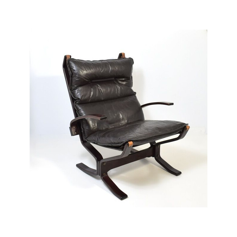 Vintage leather armchair with ottoman by Trygg Mobler, Denmark 1970