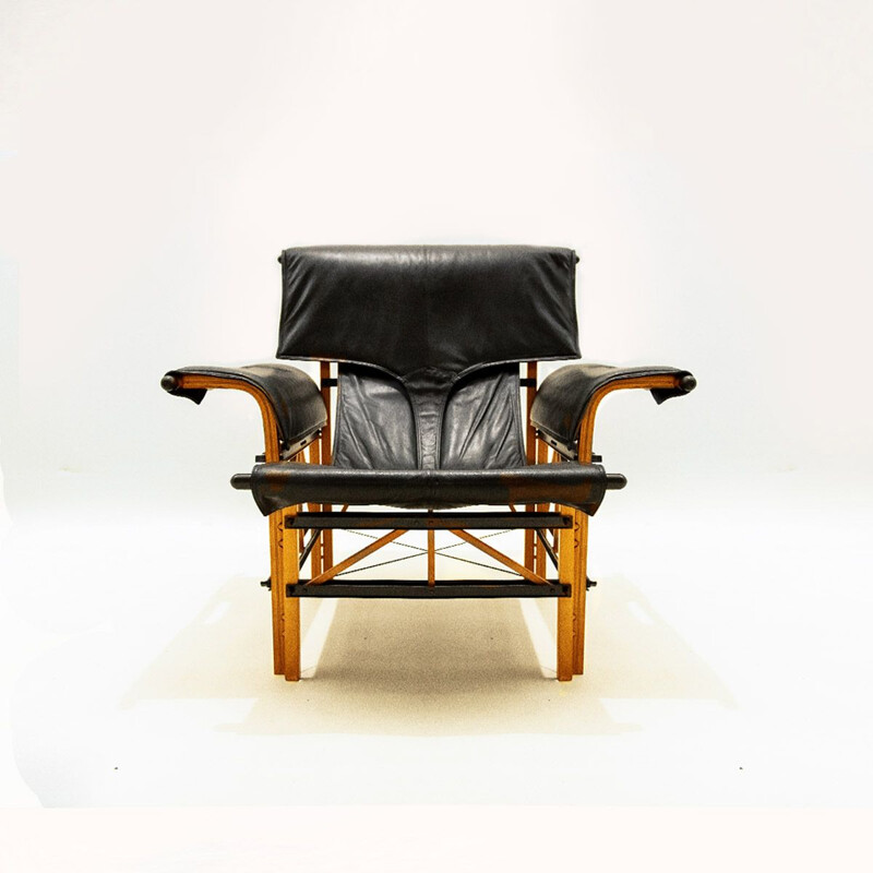 Vintage Italian black leather and wood armchair by Bernini