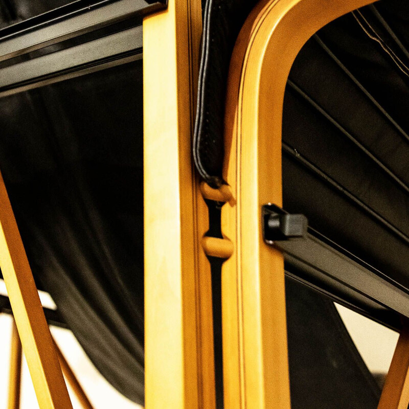 Vintage Italian black leather and wood armchair by Bernini