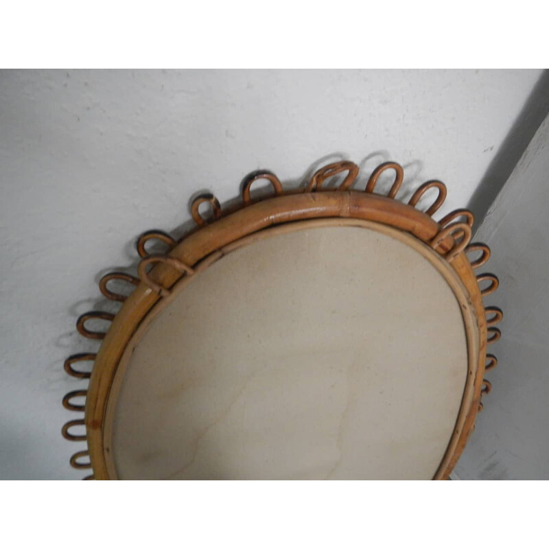 Vintage oval mirror in rattan