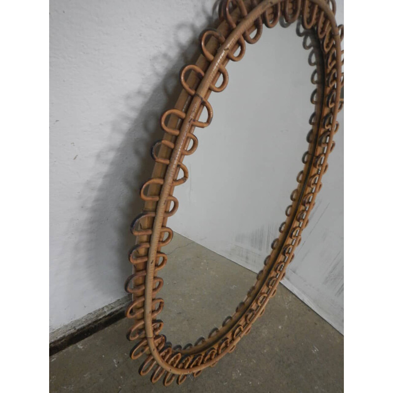 Vintage oval mirror in rattan