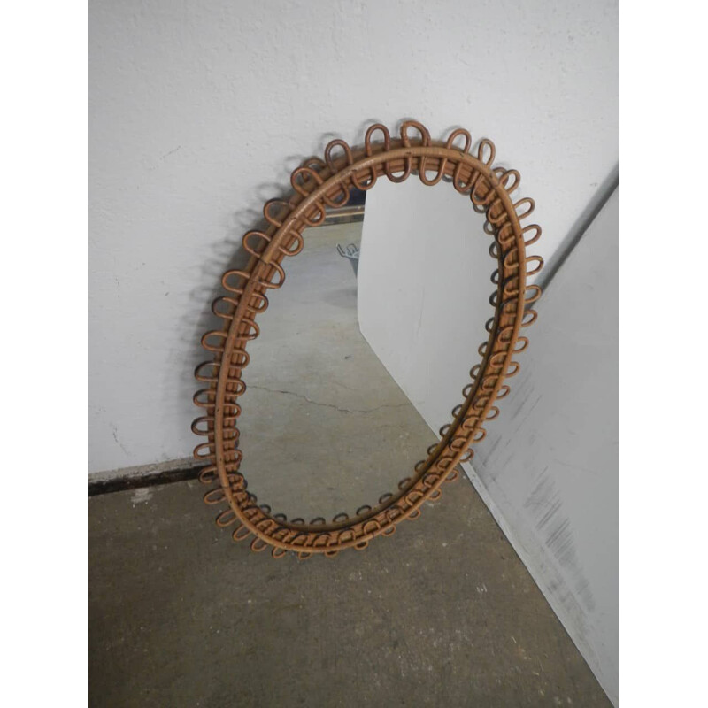 Vintage oval mirror in rattan