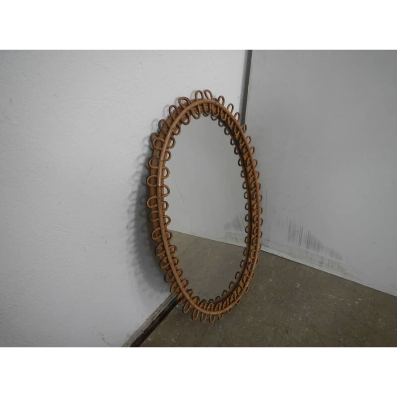 Vintage oval mirror in rattan