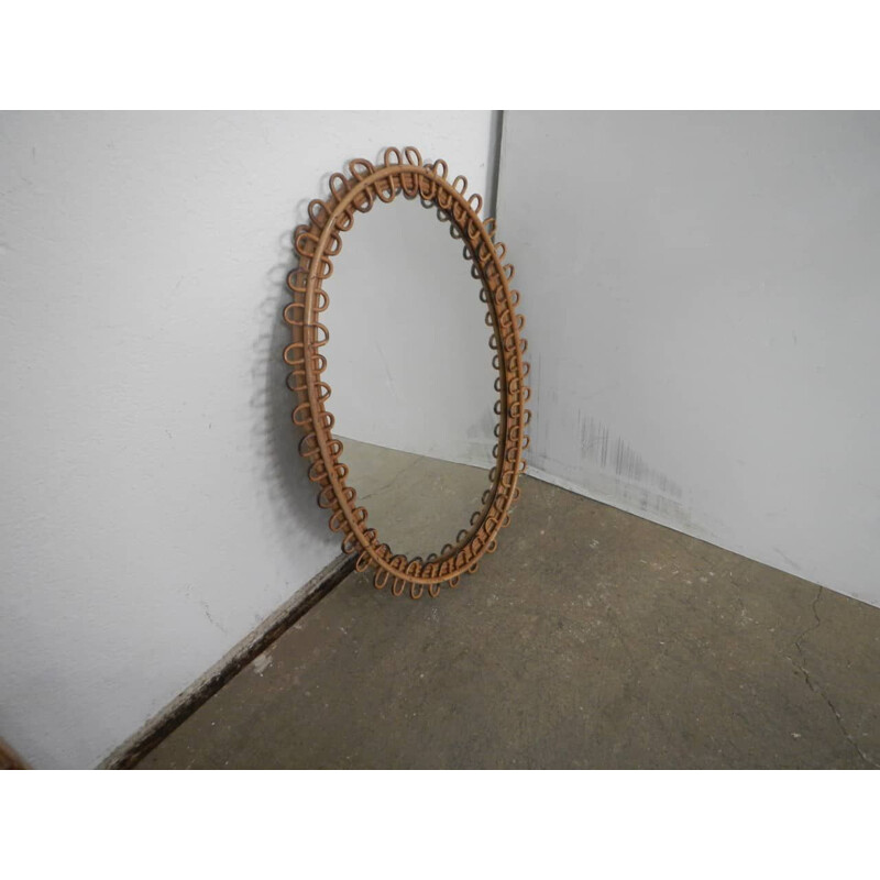 Vintage oval mirror in rattan