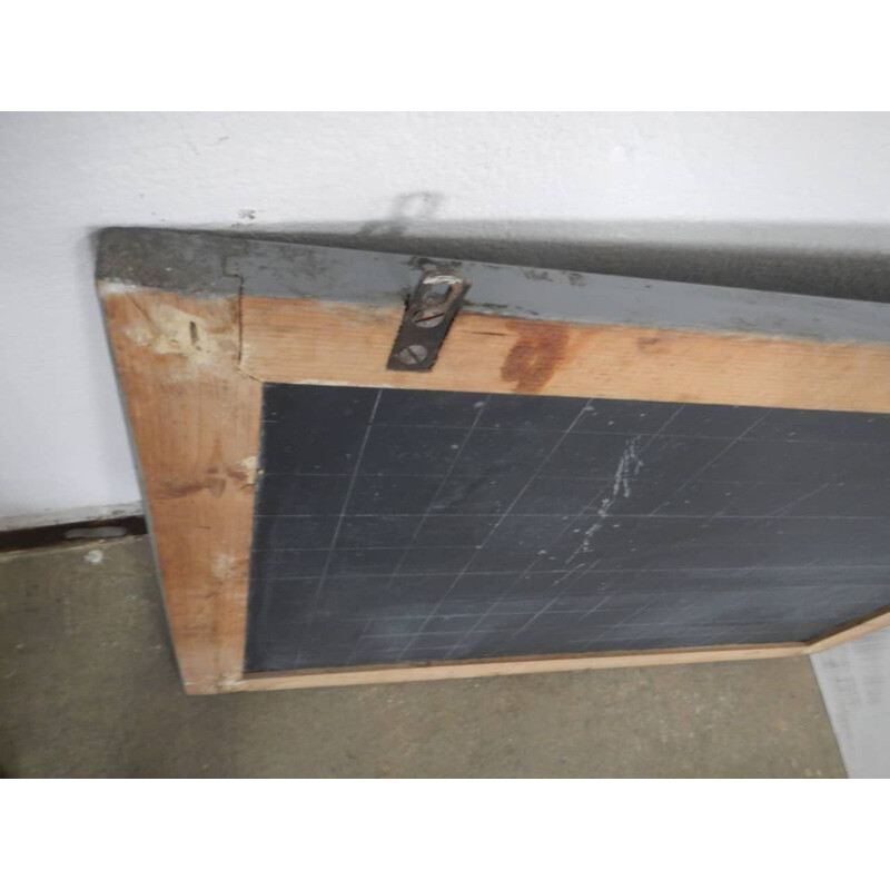 Grey vintage blackboard with chalkolder shelf