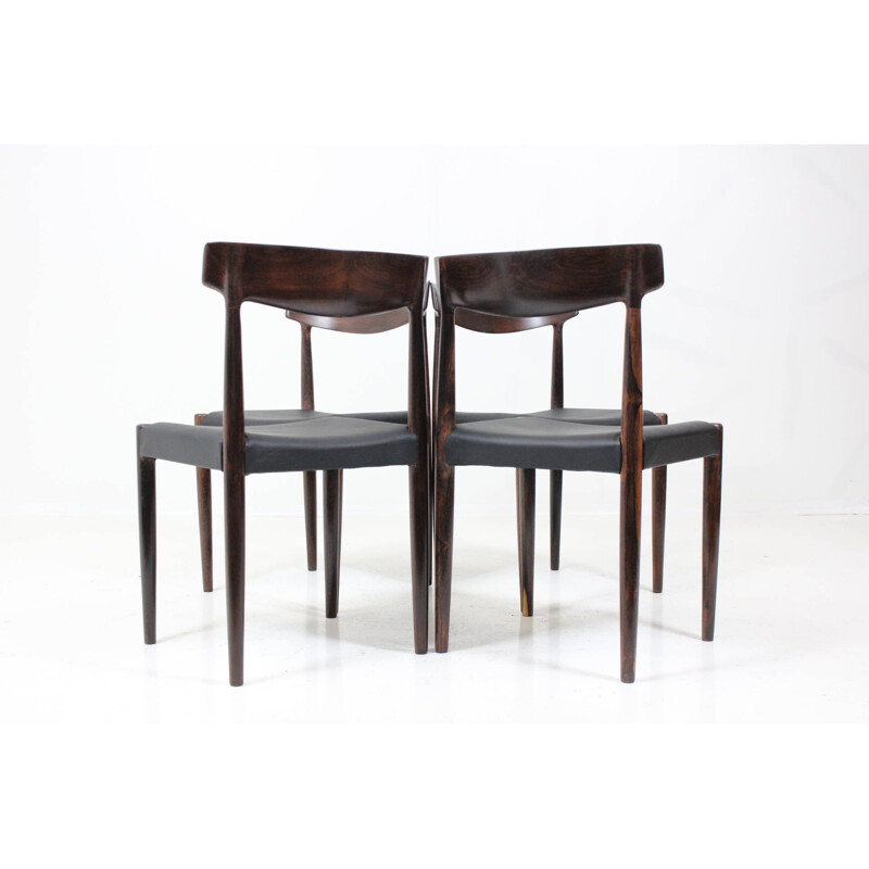 Suite de 4 chaises en palissandre massif et cuir noir - 1960