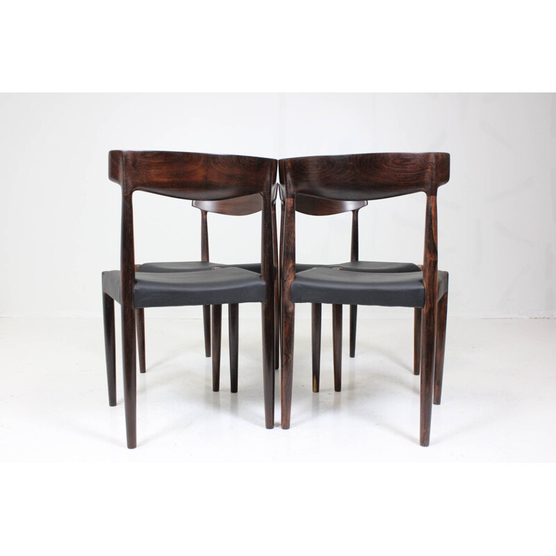 Set of 4 dining chairs in solid rosewood and black leather - 1960s