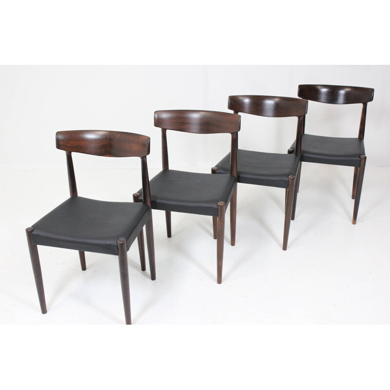 Set of 4 dining chairs in solid rosewood and black leather - 1960s