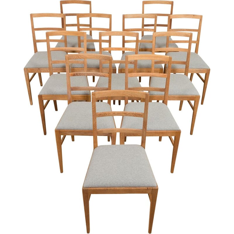 Set of 12 mid century oakwood and wool dining chairs by Fritz Hansen, 1950s