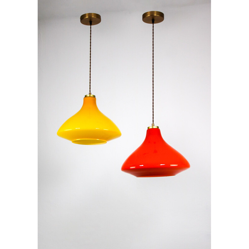 Pair of mid century yellow and orange glass pendant lamps