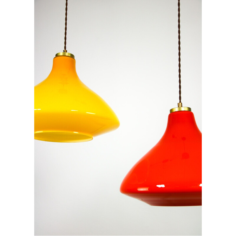 Pair of mid century yellow and orange glass pendant lamps