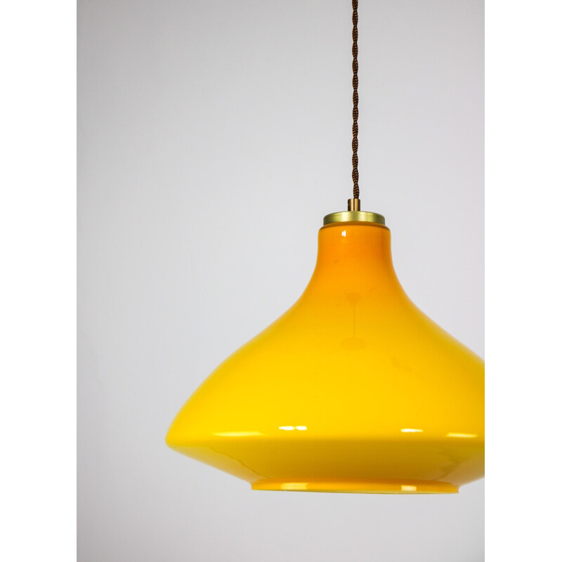 Pair of mid century yellow and orange glass pendant lamps