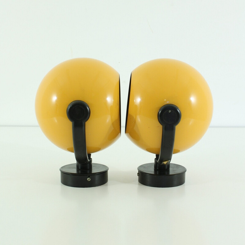 Pair of Erco wall lamps in yellow metal - 1970s